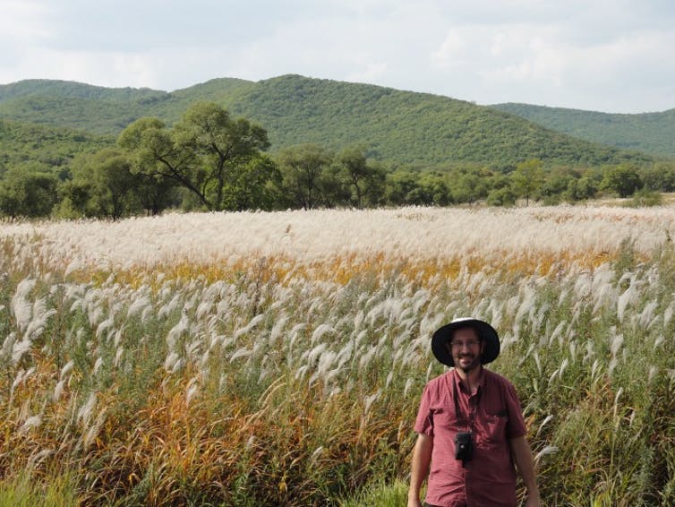 Eric Sacks with Miscanthus